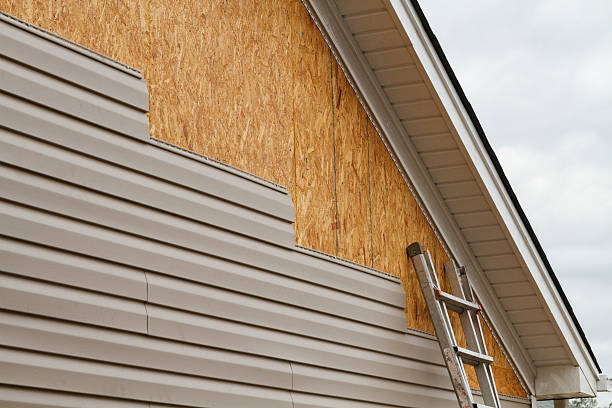 Professional Storm Damage Siding Repair technician working in Norfolk, MA
